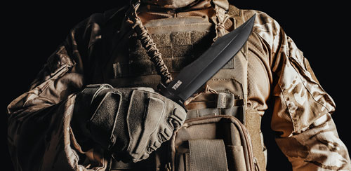 soldier holding vietnam sog knife